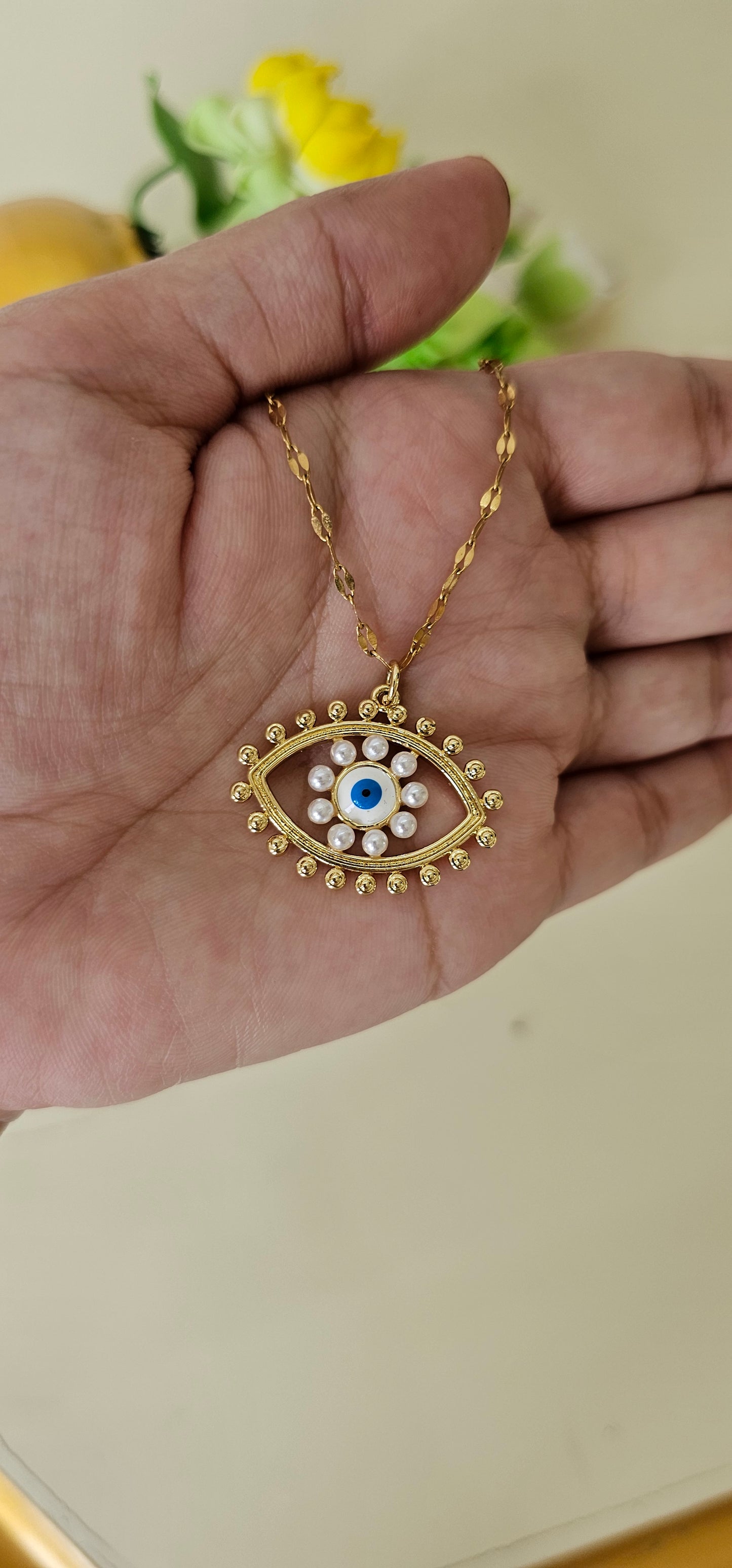 pearl studded evil eye
