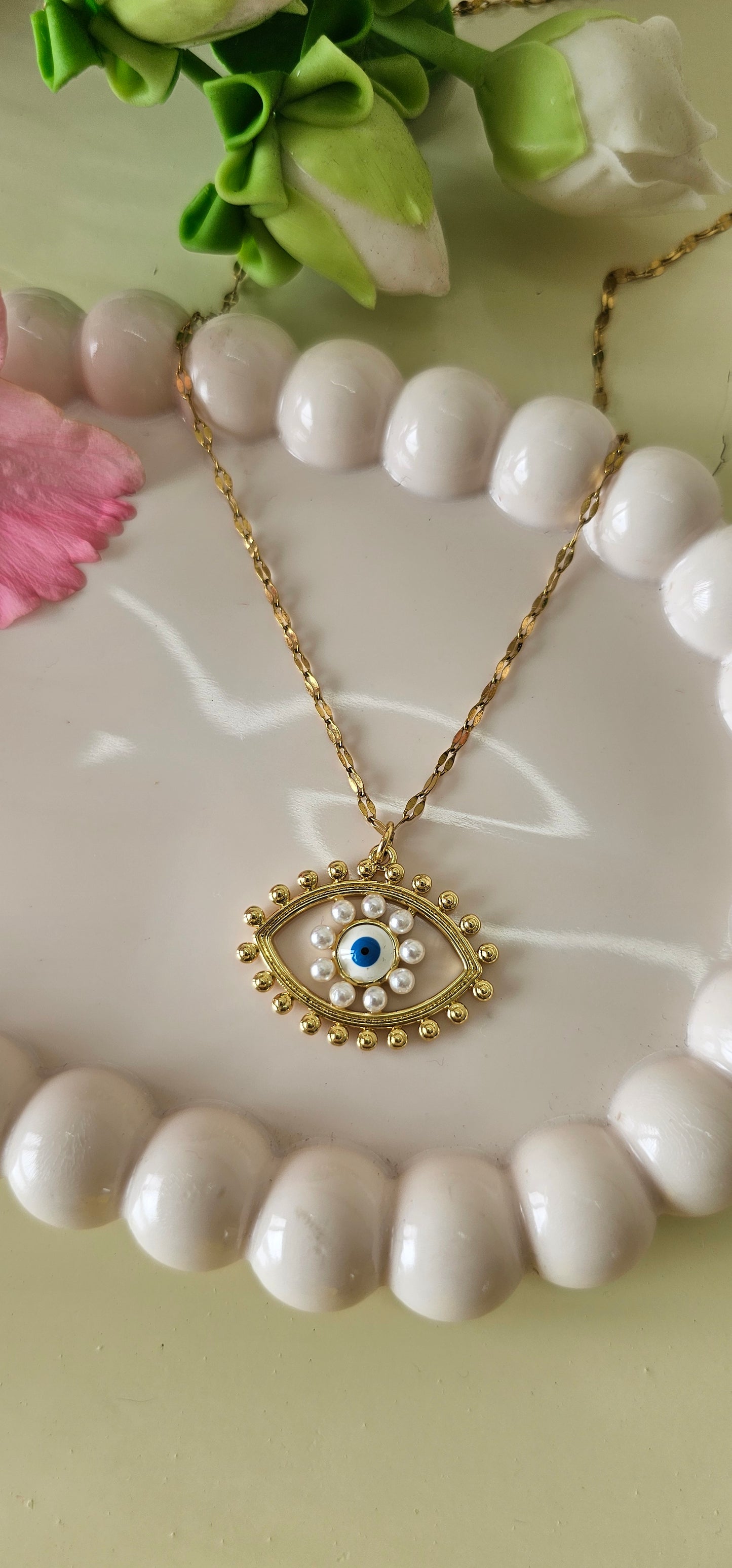 pearl studded evil eye